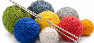 Knitting needles and balls of yarn